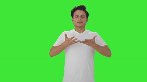 Indian-man-doing-breathe-in-breathe-out-exercise-Green-screen