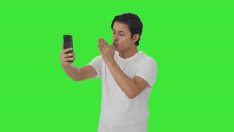 Angry-Indian-man-talking-on-video-call-Green-screen