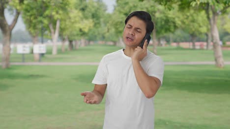 Angry-Indian-man-talking-on-call