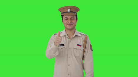 Happy-Indian-police-officer-showing-thumbs-up-Green-screen