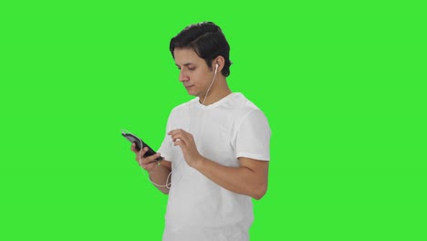 Indian-man-listening-to-songs-and-dancing-Green-screen