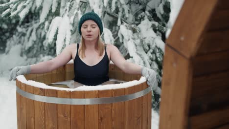 Caucasian-woman-take-a-winter-bath-in-frozen-water.