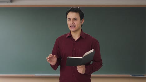 Happy-Indian-teacher-teaching-in-class