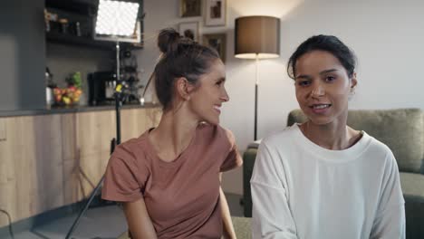 Two-female-vloggers-greeting-to-the-camera