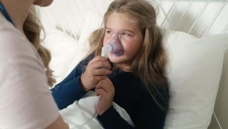 Pediatrician-giving-nebulizer-to-an-ill-child-at-home