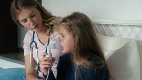 Doctor-giving-nebulizer-to-an-ill-child-at-home