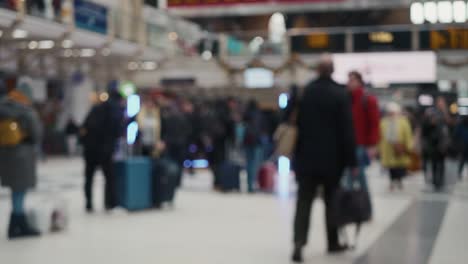 Blurred-footage-of-unrecognizable-people-passing-by-on-the-station