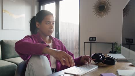 Mixed-race-woman-working-on-computer