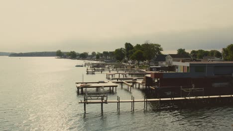 Drone-shot-of-the-beach-houses-and-docks-and-boats-for-swimming-at-Sodus-point-New-York-vacation-spot-at-the-tip-of-land-on-the-banks-of-Lake-Ontario