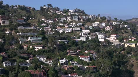 Aerial-view-of-Hollywood-Hills-West-above-Sunset-Blvd,-high-end-luxury-homes,-Los-Angeles