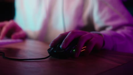 Detail-of-computer-mouse-used-by-gamer-at-night