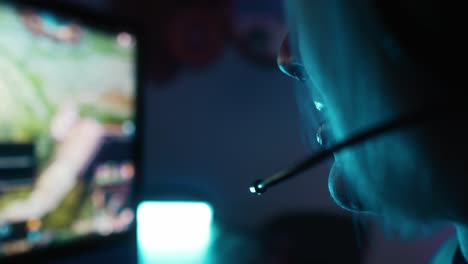 Close-up-of-unrecognizable-woman-playing-game-at-night-on-Desktop-PC
