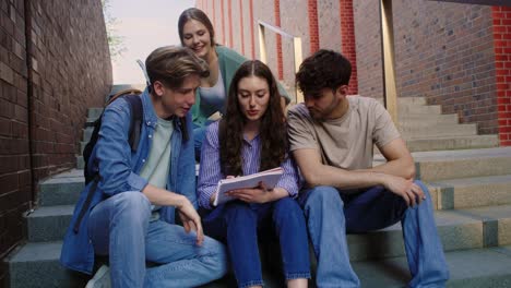 Group-of-caucasian-students-studying-outside-the-university-campus