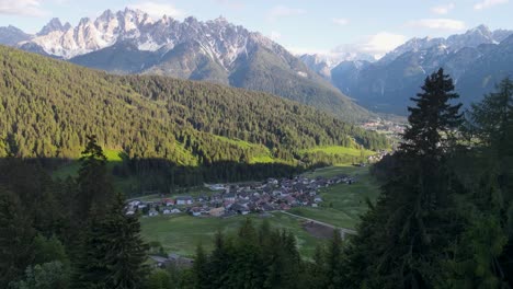 The-Italian-alpine-town-of-Toblach-comes-into-view-amid-pine-forests-and-mountains