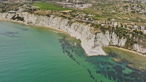 Scala-dei-Turchi-Italy-Aerial-v1-fly-around-Stair-of-the-Turks-unveils-breathtaking-coastal-scenery-of-white-marl-sea-cliffs-and-picturesque-view-of-Realmonte-town---Shot-with-Mavic-3-Cine---June-2023
