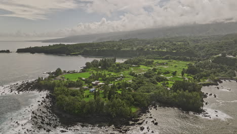 Maui-Hawaii-Aerial-v39-cinematic-drone-flyover-Ke‘Anae-peninsula-capturing-lowland-farm-fields-with-taro-plantations-and-coastal-hillside-mountain-landscape---Shot-with-Mavic-3-Cine---December-2022