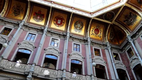 Panaroma-of-historical-shields-on-golden-backdrop-on-roof-of-Palacio-da-Bolsa