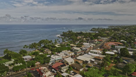 Paia-Maui-Hawaii-Aerial-v1-cinematic-drone-flyover-hippie-town-capturing-beautiful-Mantokuji-Bay,-charming-seaside-residential-houses-and-expansive-ocean-views---Shot-with-Mavic-3-Cine---December-2022