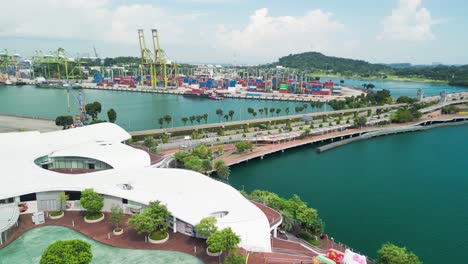 Sentosa-Bridge-view,-Singapore-with-port-and-iconic-architecture---aerial-panoramic