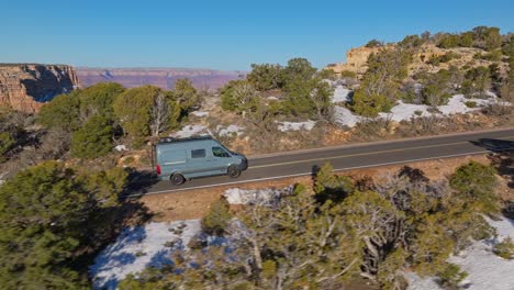Aerial-Of-A-Van-Traveling-On-The-Steep-Roads-Near-Grand-Canyon-National-Park-In-Arizona,-United-States
