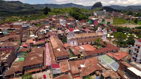 Umbrella-colourful-street-and-colonial-cathedral-in-Guatape-picturesque-village