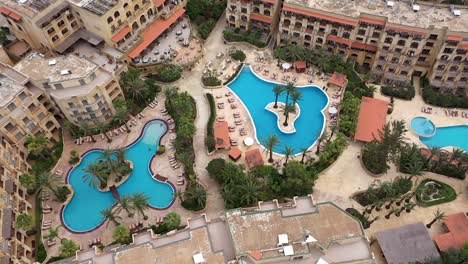 Aerial-view-of-a-hotel-complex-and-its-surroundings-on-the-Maltese-island-of-Gozo