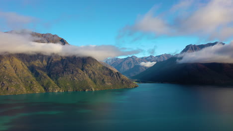 Picturesque-aerial-view-flying-over-a-lake-in-the-scenic-mountain-landscape-of-New-Zealand's-South-Island