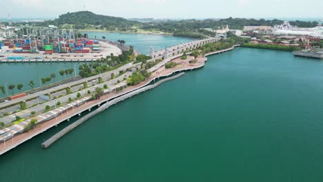 Aerial-of-the-bridge-to-Sentosa-Island-in-Singapore,-officially-known-as-the-Sentosa-Gateway,-offers-visitors-a-picturesque-path-to-this-vibrant-resort-island