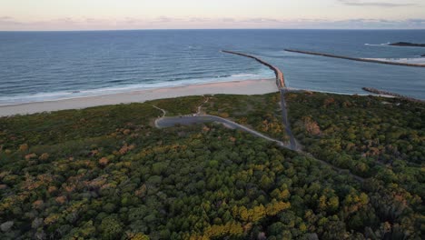 Flying-Over-The-Forest-At-Iluka-Nature-Reserve---Iluka-Beach-And-Clarence-River-In-NSW,-Australia