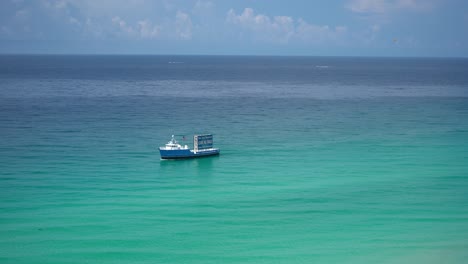 Turquoise-water-with-Digital-banner-advertising-boat-Fort-walton-beach-Destin-Florida