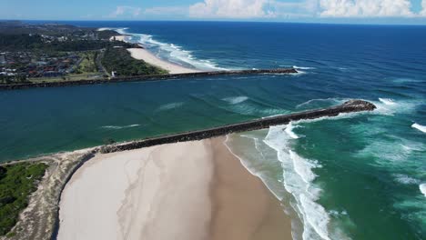 Aerial-View-Of-Waves-Coming-To-The-Shoreline-Of-Beaches-In-Ballina---Richmond-River-Mouth-In-NSW,-Australia