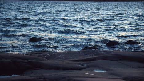 Waves-crashing-at-the-sandy-sea-shore-at-sundown