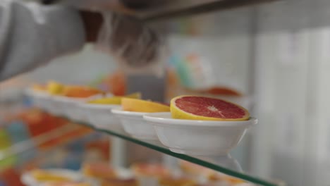 Grapefruit-being-prepared-as-a-dessert-by-a-caterer