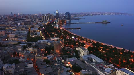 Aerial-view-of-Baku-city-seaside-at-evening-dawn,-Azerbaijan