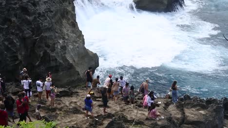 Tourists-see-the-powerful-crashing-of-sea-waves