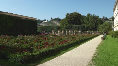 People-Walking-Around-Mirabell-Palace-Gardens-on-a-Sunny-Day
