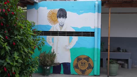 Diego-Maradona's-house-in-Villa-Fiorito-has-a-mural-painted-next-to-other-tributes-to-the-former-footballer