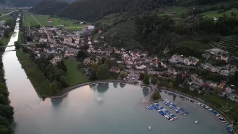Aerial-drone-view-flying-forward-of-Weesen-town-based-near-shore-of-Walensee-lake,-Switzerland