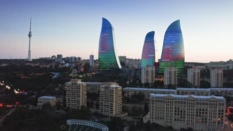 Aerial-view-of-Baku-city-modern-landmarks-at-evening-dawn,-Azerbaijan