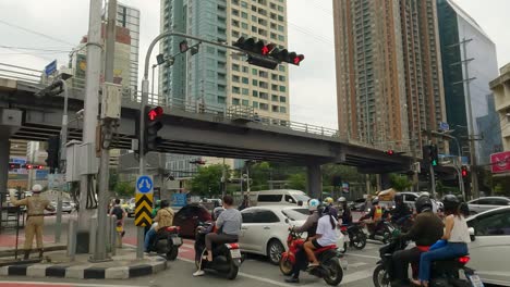 Street-View-Of-Motorcycles-And-Motorists-Sitting-In-Rush-Hour-Traffic