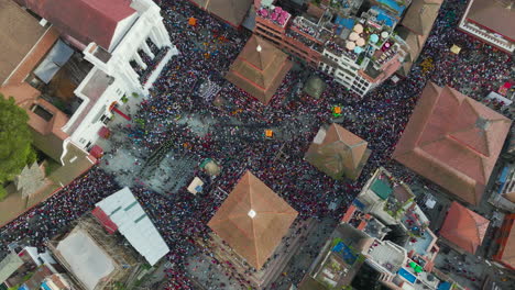 People-run-in-crowds-at-Indra-Jatra-Festival-at-Basantapur-Durbar-Square,-Kathmandu-Nepal