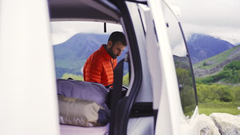 Aiguestortes-national-park-male-trekker-climber-living-in-a-van-parked-in-stunning-amazing-location