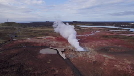 Smoke-in-the-form-of-sulfur-vapor-rising-from-the-Gunnhuver,-Iceland