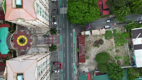 Forward-overhead-aerial-shot-over-Quezon-City-in-Philippines-on-sunny-day