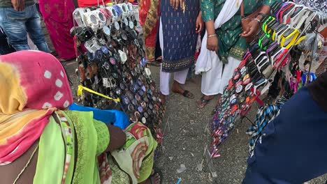A-woman-shopkeeper-is-selling-hand-clocks-at-a-fair