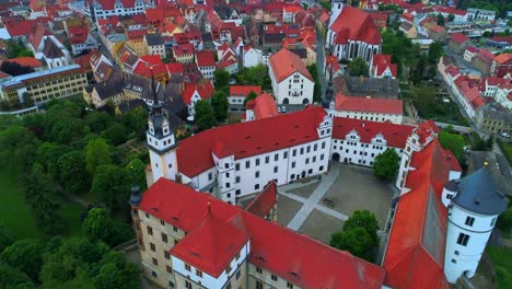 4K-Aerial-Torgau-Castle-Pull-Back-Schloss-Hartenfels-German-Streets-Europe-Saxony-Germany-Tourism-Reformation-Medieval