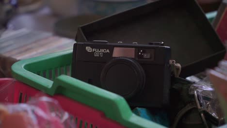 Closeup-shot-of-Vintage-camera-on-the-plastic-basket