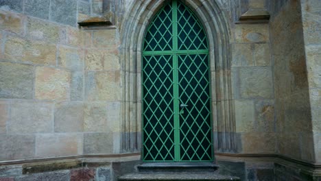 Large-church-door-with-green-fittings