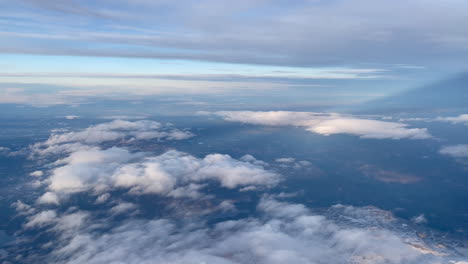 Aerial-shot-from-plane-over-mountains-and-clouds-in-Norway
