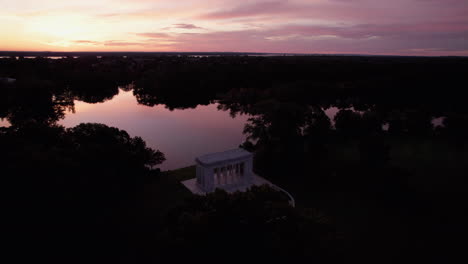 Circular-drone-flight-at-dusk-over-the-lakes-and-temple-in-Roger-Williams-Park